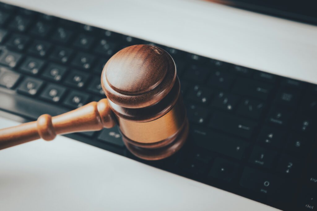 A gavel rests on a computer keyboard.