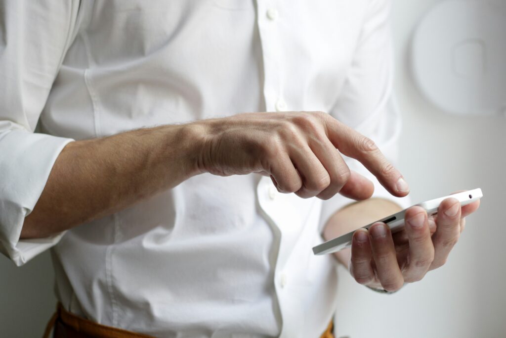 A person interacting with their mobile phone.