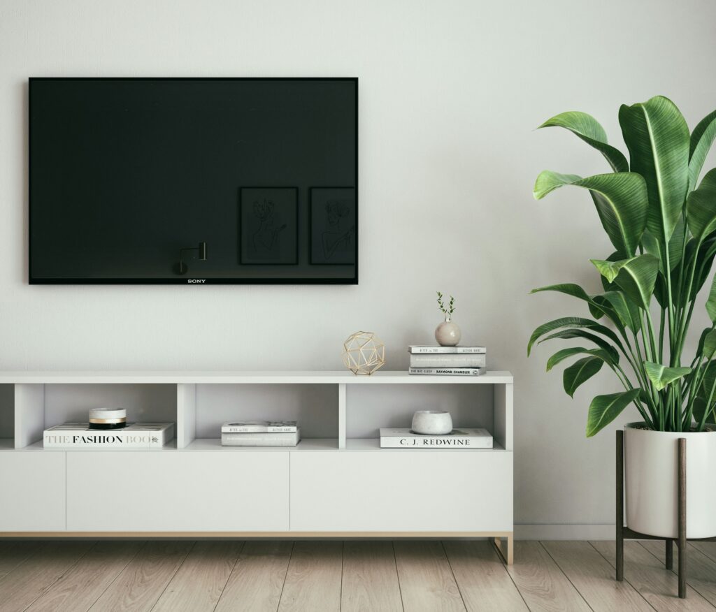 A TV mounted on a living room wall.