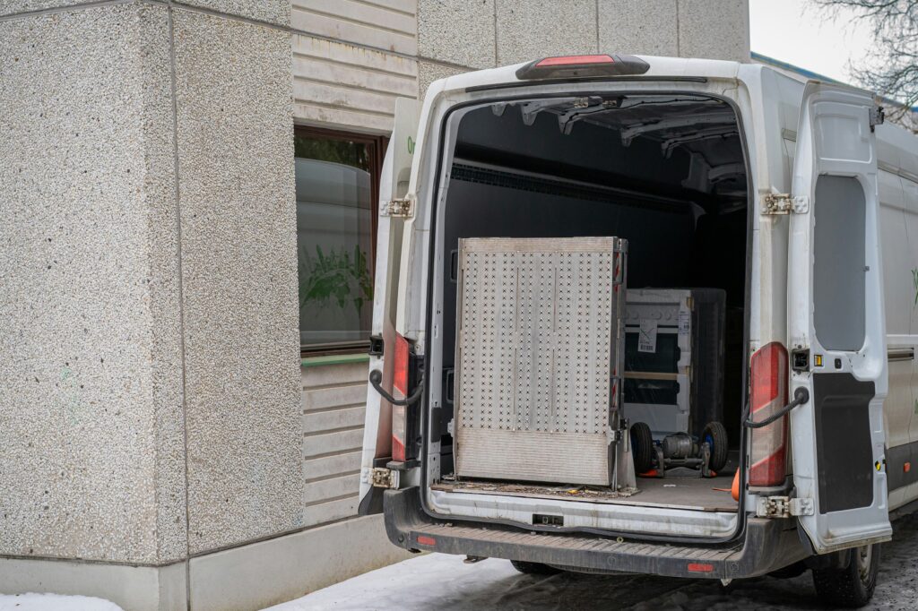 A white van with its rear doors open.