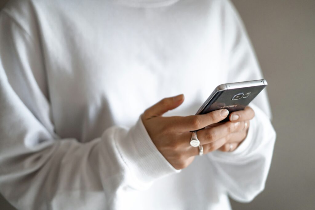 A person is checking their mobile phone.