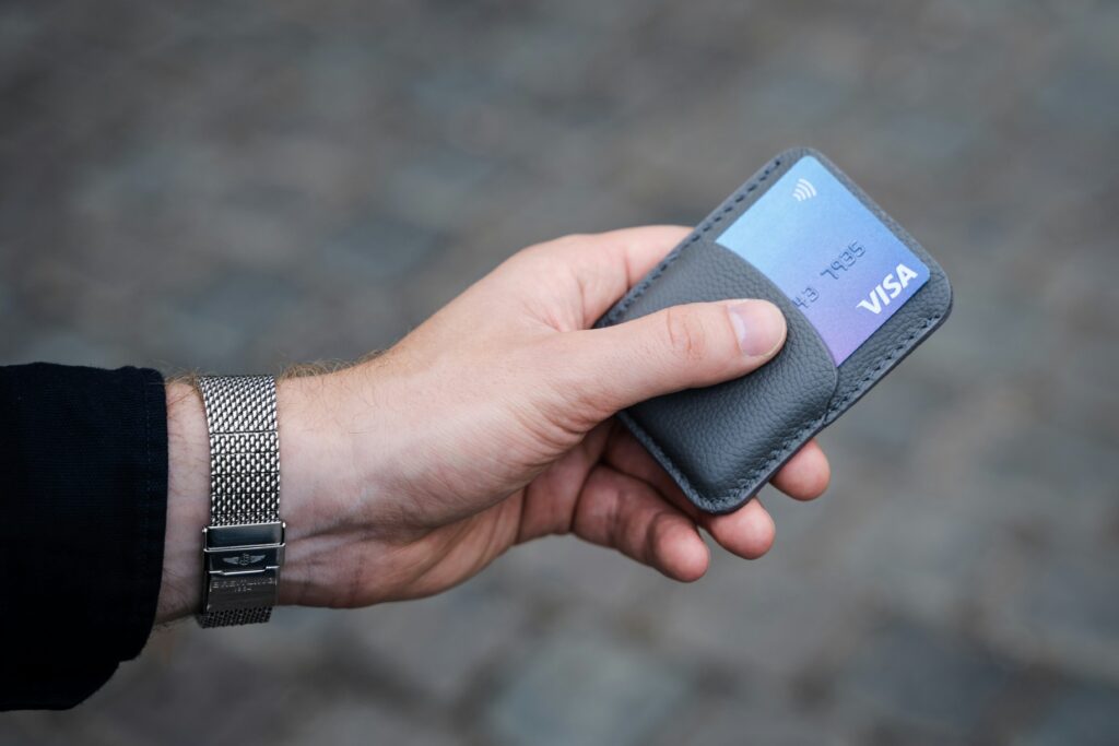 A person holding a credit card.