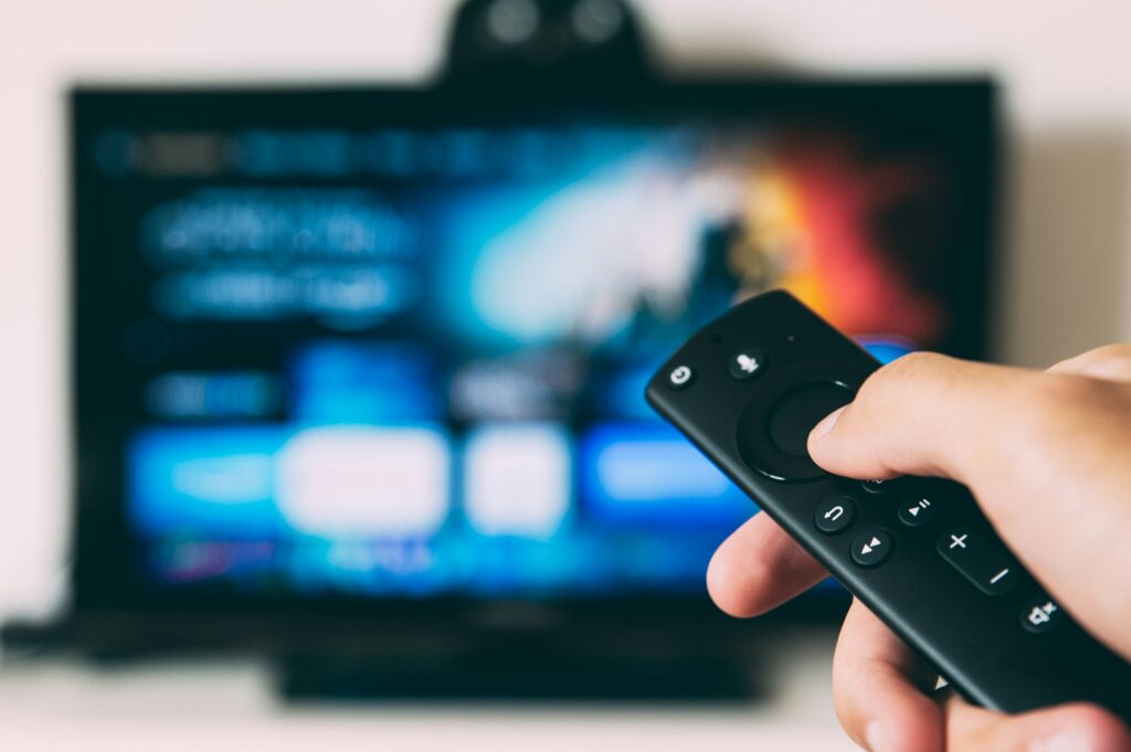 A person watching TV.